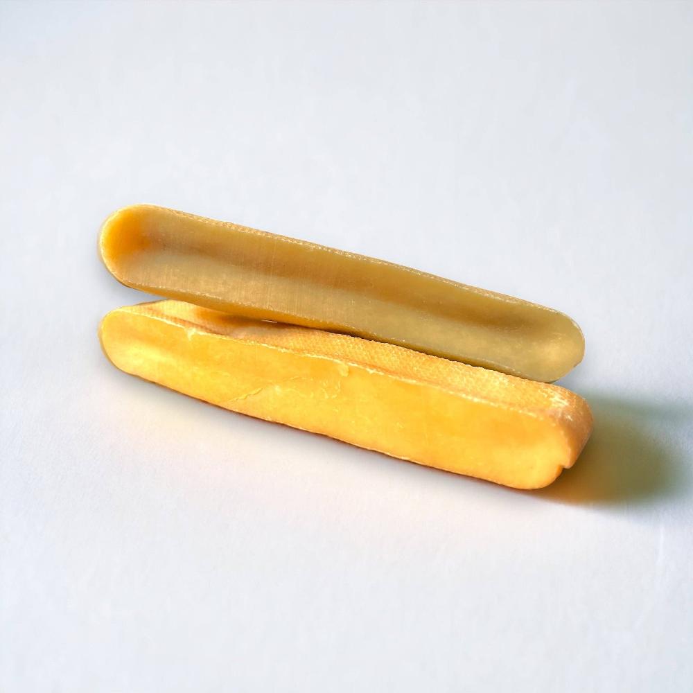 Two Himilayan Yak Chews laid together